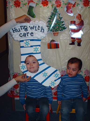 Two children posing for pictures at the BSS Christmas party
